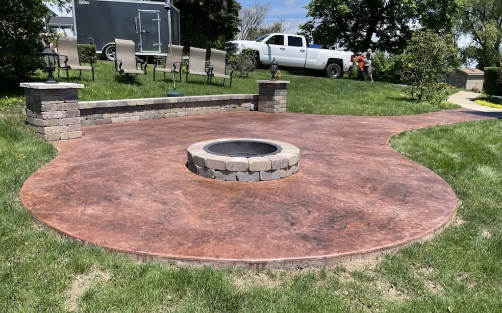 Stamped concrete patio with circular fire pit